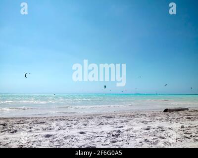 Kite surfing on the White Beach Rosignano Solvay with Caribbean-blue waters and bright white sands on sunny day. Tuscany, Italy Europe Stock Photo