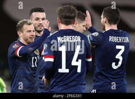 Scotland's Ryan Fraser (left) celebrates scoring their side's fourth goal of the game during the 2022 FIFA World Cup Qualifying match at Hampden Park, Glasgow. Picture date: Wednesday March 31, 2021. Stock Photo