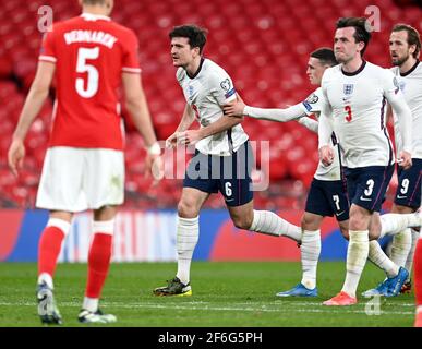 England's Harry Maguire celebrates scoring their side's second goal of the game during the 2022 FIFA World Cup Qualifying match at Wembley Stadium, London. Picture date: Wednesday March 31, 2021. Stock Photo