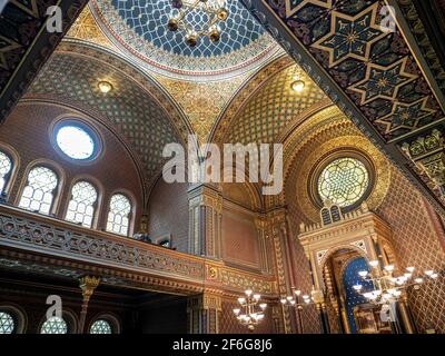 The ceiling and front of the Spanish Synagogue in Prague: The ceiling, balcony and south wall of the restored Spanish Synagogue in Prague. Gold leaf and exquisit morish decorations abound. Stock Photo
