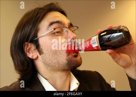 Jerome Taylor tries MIRACLE FRUIT ( Synsepalum Dulcificum) which makes sour and bitter foods taste sweeter.photograph by David Sandison The Independent Stock Photo