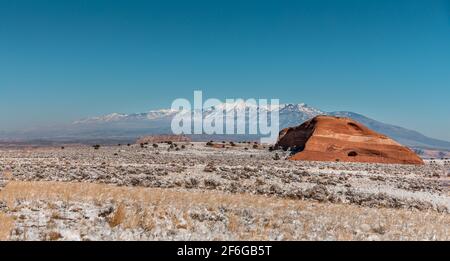 Winter landscape in Utah with snow covered meadows and the Rockies in the background Stock Photo
