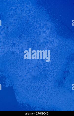 deep rich blue background with weathering texture and discoloration Stock Photo