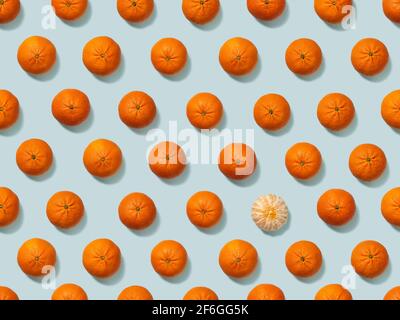 Tangerines on a sky-blue background. Seamless pattern, for packaging paper. Find the differences. Stock Photo