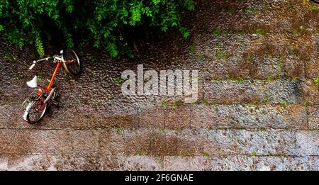 The rainy bike is chilling. In the rain. Stock Photo