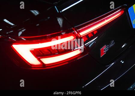 The Rear Tail Light And Model Designation S4 Badge On A 2017 Audi S4 Saloon In Black Stock Photo