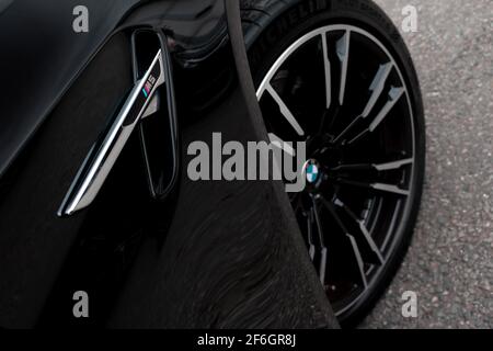 The BMW M5 Logo On The Side And Wheel Of A 2018 BMW M5 F90 Competition Pack Stock Photo
