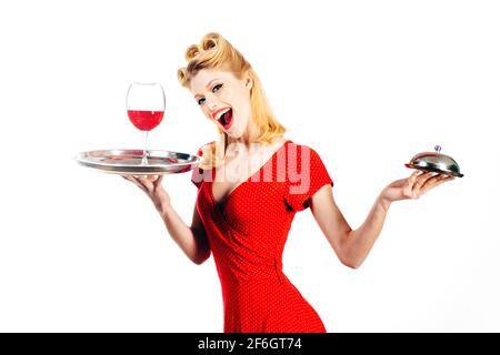 Retro restaurant serving. Pin up girl with wine and service tray. Stock Photo