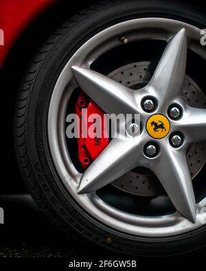 The Ferrari Logo On The Wheel And Brake Calliper Of A Red 2001 Ferrari 360 Modena Spyder Stock Photo