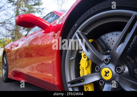 The Front Wheel Badge On The Front Wheel With Yellow Brake Calliper Of A 2015 Ferrari 458 Speciale Stock Photo