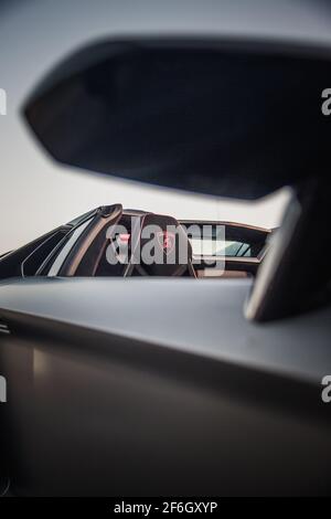 A 2016 Lamborghini Aventador SV Roadster With Gloss Black And Red Interior With Carbon Fibre Race Seats With Lamborghini Logo On The Headrest Stock Photo