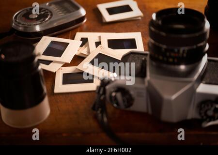Analog camera, slides and light meter Stock Photo