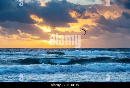 United States, Florida, Delray Beach, Kite surfer in ocean at sunrise Stock Photo