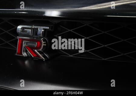 The Nissan GTR Logo On The Side Of The Front Grille Of The Car On A 2013 Nissan GTR R35 Premium