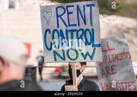 Seattle, USA. 31th Mar, 2021. Late in the day people protesting at City Hall calling for rent forgiveness and extension on the rent moratorium. Over 5 million Americans have missed rent payments since the Covid-19 pandemic hit the United States. Credit: James Anderson/Alamy Live News Stock Photo