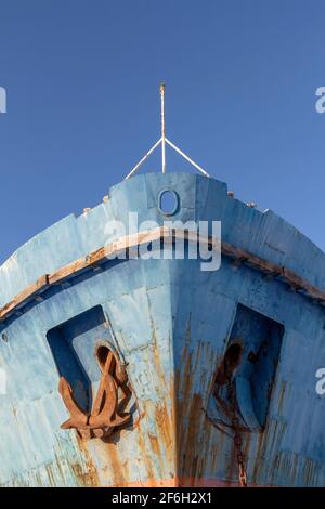 Rusty anchor of an old ship in a junkyard. Stock Photo