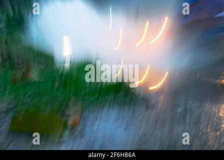 Abstract natural multicolored blurry background with flashing traffic lights Stock Photo