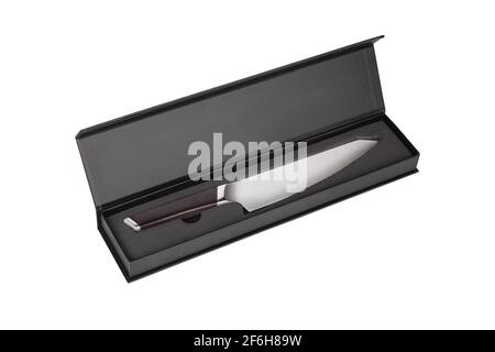 Carving knife with wooden handle in Black box isolated on white background. Knife for carving cooked meat into slices. Stock Photo