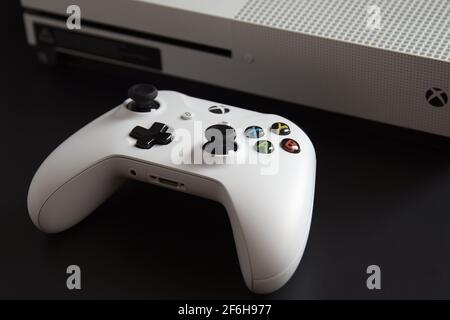 MEXICO CITY, MEXICO - MARCH 18 2021: Console and game controller of a white Xbox One.