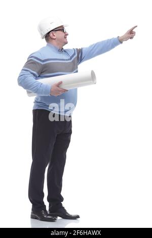 side view. a man with a roll of drawings looking somewhere ahead. Stock Photo