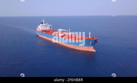 Bulk Carrier Ship at sea. Aerial view. Stock Photo