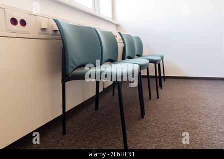 Chairs arranged in a row Stock Photo