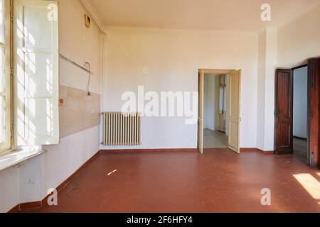 Old, empty kitchen in country house, sunlight Stock Photo