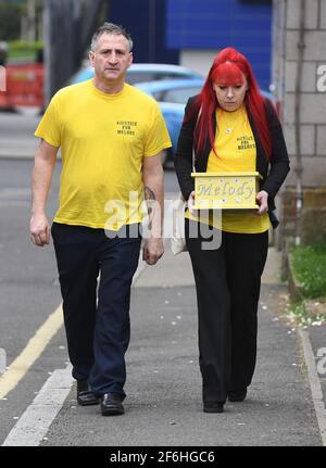 Nigel and Karina Driscoll, the parents of Melody Driscoll, arrive at Southwark Coroner's Court, south east London, carrying a box with her ashes in, during the inquest into her death. The Driscolls have alleged medics at King's College Hospital (KCH) reduced Melody's quality of life and contributed to her death, including improperly reducing her pain and steroid medications. Picture date: Thursday April 1, 2021. Stock Photo