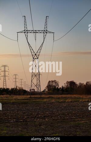 Pylon with insulatros and lines, wires. High voltage transmission line. Stock Photo