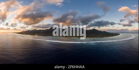 Dramatic aerial panorama of the sunset over the Rarotonga island, the main of the Cook islands archipelago in the south Pacific ocean. Stock Photo