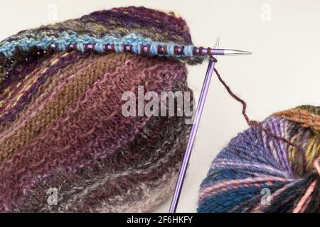 Knitting using  circular needles and yarn Stock Photo
