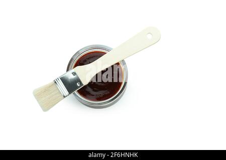 Glass jar of barbecue sauce with brush isolated on white background Stock Photo