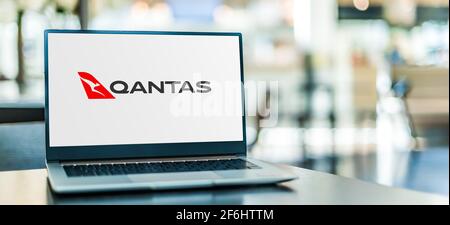 POZNAN, POL - MAR 15, 2021: Laptop computer displaying logo of Qantas Airways,  the flag carrier of Australia Stock Photo