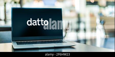 POZNAN, POL - MAR 15, 2021: Laptop computer displaying logo of Datto, an American cybersecurity and data backup company Stock Photo