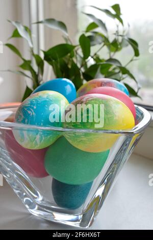 Easter eggs. Beautifully painted chicken and quail eggs in a crystal vase Stock Photo