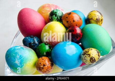 Easter eggs. Beautifully painted chicken and quail eggs in a crystal vase Stock Photo