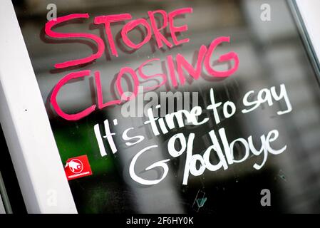 Oldenburg, Germany. 01st Apr, 2021. The English words 'Store Closing' and the addition 'It's time to say Goodbye' with a percent sign are written on the window of a closed store in the city center. In view of sharply rising Corona infection figures, the German government has extended the lockdown in Germany until April 18, 2021. Credit: Hauke-Christian Dittrich/dpa/Alamy Live News Stock Photo