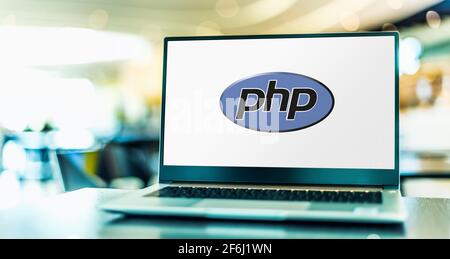 POZNAN, POL - MAR 15, 2021: Laptop computer displaying logo of PHP, a general-purpose scripting language especially suited to web development Stock Photo