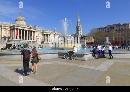 London, England, UK. Trafalgar Square on the warmest March day for 50 years - March 30th 2021