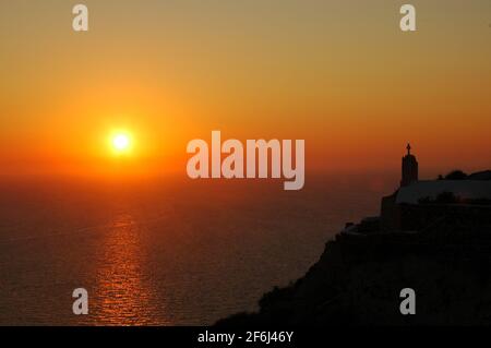 Sunset Over Oia On The Island Of Santorini In The Aegean Sea. Stock Photo