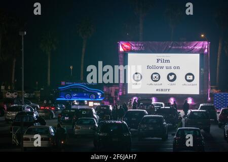 Santa Barbara, United States. 31st Mar, 2021. 36th Santa Barbara International Film Festival opening night screening of “Invisible Valley” at a Santa Barbara City College parking lot Drive-in Theaters in Santa Barbara, California, March 31, 2021. SBIFF had two high end beachside Drive-ins installed to screen select films, all with free admission and moved this years festival online which included all their Celebrity Tributes, Panel Discussions, Filmmaker Q&As and over 100 films. (Photo by Rod Rolle/Sipa USA) Credit: Sipa USA/Alamy Live News Stock Photo