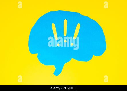 problem concept, blue brain layout with exclamation marks on yellow background Stock Photo