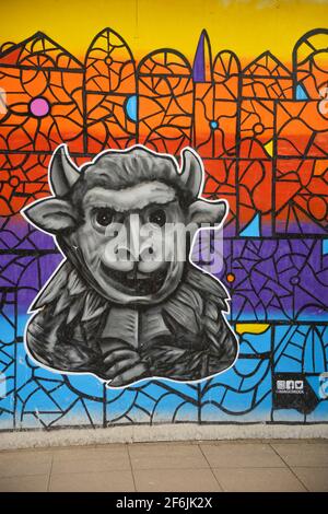Legend of the Lincoln Imp, Lincoln Cathedral, locations throughout Lincolnshire, old legend, devil sent his imps, old store front, graffiti colourful. Stock Photo
