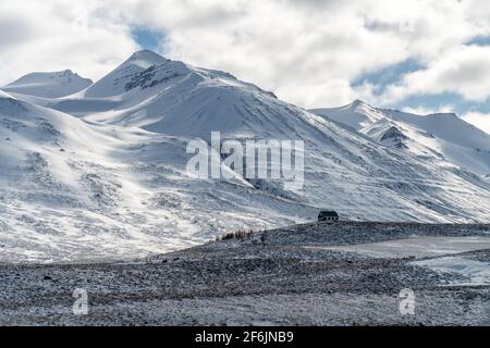 A lonely abandoned structure among the mountains in the snow. Winter in Iceland Stock Photo
