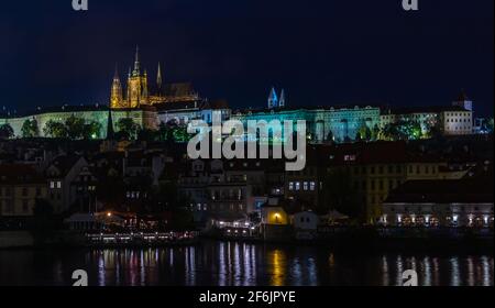 A picture of the Prague Castle complex taken from the other side of the Vltava river at night. Stock Photo