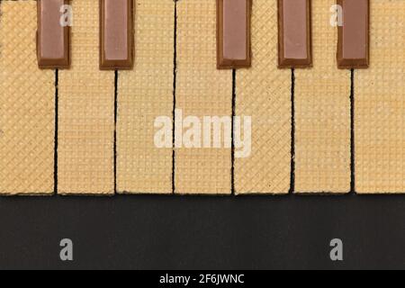 Conceptual Top View of Piano Keys from Wafers bars and Chocolate bars Stock Photo