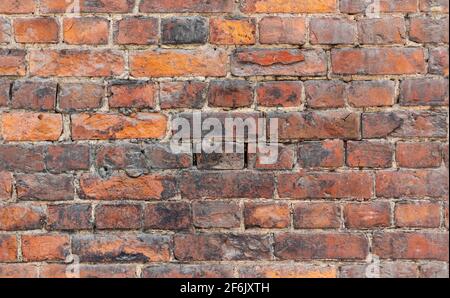 Seamless background photo of grungy red old brick wall, close-up photo texture Stock Photo
