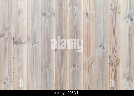 New wooden wall made of vertical pine wood planks, background photo texture Stock Photo