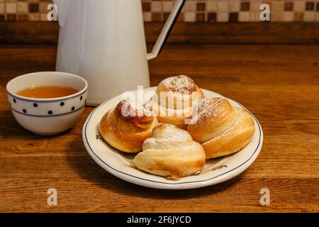 Traditional Easter baking served with honey at breakfast.Delicious homemade hot buns from sweet yeast dough, CZ jidase, traditionally baked in Czech Stock Photo