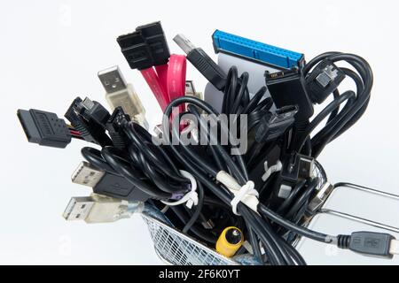 technological waste that remains in residence as computer cables Stock Photo